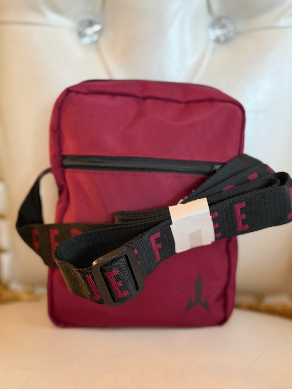 Jeffree Star Burgundy Crossbody Bag with Black Strap